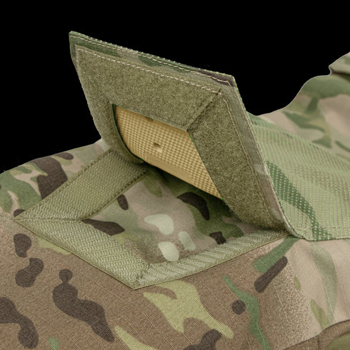 Close-up of Condor’s Paladin Tactical Pants in MultiCam, featuring an open Velcro flap revealing a ballistic trauma pad insert.